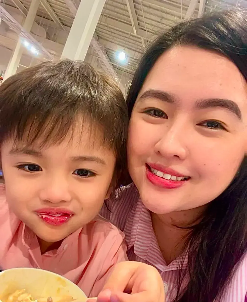 Marian Matias Enguero with her son Justin